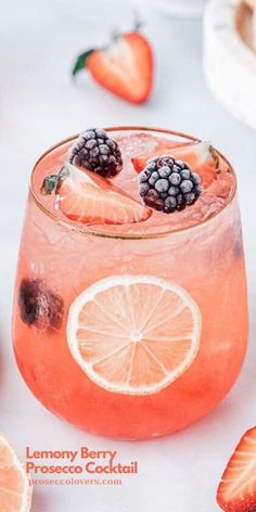 a close up of a drink in a glass with fruit on the rim and garnish