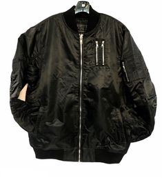 Lightly padded bomber jacket with zipper detailing. Casual Black Biker Jacket With Ribbed Cuffs, Trendy Black Outerwear With Zip Cuffs, Black Biker Jacket With Ribbed Cuffs, Black Long Sleeve Biker Jacket With Ribbed Cuffs, Casual Biker Jacket With Multiple Pockets For Streetwear, Winter Biker Jacket With Ribbed Cuffs For Streetwear, Casual Black Outerwear With Zip Cuffs, Casual Biker Jacket With Zip Cuffs, Biker Jacket With Pockets For Streetwear