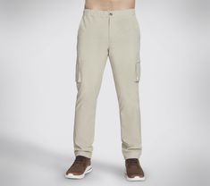 Enjoy standout comfort and convenience wearing Skechers Skechweave Twill Downtown Solid Cargo Pant. This full length cargo pant features a zip fly with button closure, elasticated waistband with adjustable drawcord, front slash pockets, low profile cargo pockets, and adjustable twill-tied bottom hems. | Skechers Men's Twill Downtown Solid Cargo Pants | Skechweave Twill is a cotton twill fabric with a water repellent finish | Full length cargo pant | Relaxed Fit | 100% Nylon | Zip fly with button Cargo Pants Style, Waterproof Shoes, Skechers Women, Cargo Pant, Twill Fabric, Bottom Clothes, Cotton Twill Fabric, Pants Outfit, Canvas Shoes