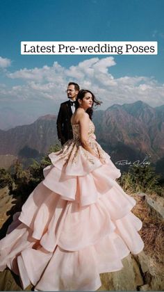 a man and woman standing on top of a mountain