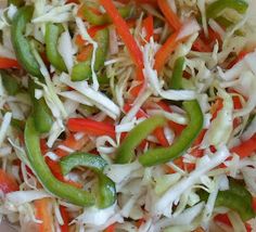 shredded carrots, peppers and cabbage in a bowl