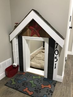 a dog house made out of wood and painted white