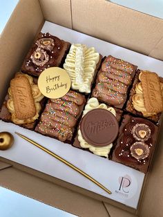 a box filled with lots of different types of cookies