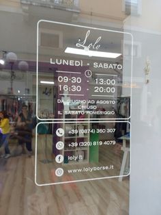 a sign in the window that says lunch and sabato, on it's side