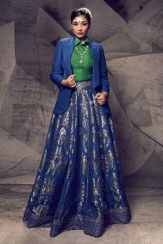 Blue brocade lehenga with an attached cancan, woven pattern and gota embroidery. Comes with a green silk shirt and a blazer.
Components: 3
Pattern: Woven, Embroidered
Type Of Work: Gota
Neckline: Blazer: Lapel collar, Shirt: Collar
Sleeve Type: Full
Fabric: Silk, Lehenga: Brocade
Color: Blue
Other Details: 
Length: Lehenga - 43 inches
Closure: Shirt - Front buttons
Note: Necklace worn by the model is not for sale.
Occasion: Destination Wedding - Aza Fashions Brocade Blazer Women, Formal Blue Choli With Zari Work, Formal Festive Brocade Lehenga, Blue Formal Choli For Festive Occasions, Blue Festive Formal Choli, Festive Blue Formal Choli, Blue Lehenga For Diwali Formal Occasion, Elegant Blue Lehenga For Formal Occasions, Formal Brocade Lehenga With Pallu