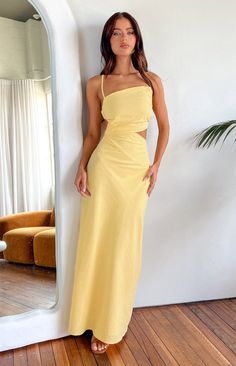 Yellow Maxi Dress  How to style: This yellow maxi dress () is screaming a summer day party! Pair it with white heels () and gold jewellery () to elevate the look and you are ready to go and be the centre attention in that room!  Features:     * Light weight material   * Non-stretch material   * Lined   * Adjustable straps   * Square neckline   * Maxi length   * Cut detailing on left side   * Stretch straps in the back    * Invisible zips on left side Summer Day Party, Prom Midi Dress, Yellow Maxi Dress, 60's Dress, Yellow Maxi, Beginning Boutique, Dress Inspo, White Heels, Strapless Tops