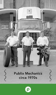 three men standing next to each other in front of a truck