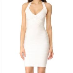 Adrienne Halter Dress In Alabaster A Classic Bandage Dress From Herve Leger. Halter Neckline. Sleeveless. Hidden Back Zip. Unlined. Fabric: Ribbed Knit. 90% Rayon/9% Nylon/1% Spandex. Dry Clean. Imported, China. Measurements Length: 34.25in / 87cm Herve Leger Dress Outfit, White Herve Leger Dress, Herve Leger 1996, Herve Leger Dress Bandage Gold, Herve Leger White Dress, Herve Leger Dress Bandage, Herve Leger Fringe Dress, Bandage Dress Herve Leger, 90s Runway