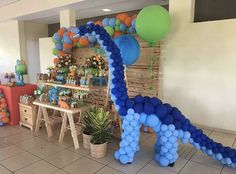 a room filled with lots of balloons and decorations