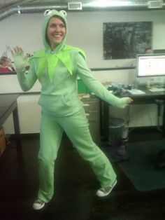 a woman in a frog costume is dancing