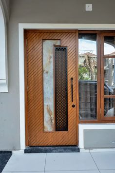 a wooden door with glass panels on the outside