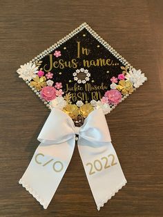 Hi everyone! this graduation cap topper is the perfect addition to your special day! It is made with heavy glitter card stock and permanent vinyl for the text. The paper flowers are all handmade by me and are what make my graduation cap toppers unique and elegant. This cap is made of high quality, durable materials that will keep you sparkling throughout your special day! How to attach to your graduation cap: There are double sided adhesive strips on the back, just peel off the backing and stick Adjustable White Graduation Accessories, Adjustable White Graduation Cap Topper, White Adjustable Graduation Accessories, Personalized Graduation Cap Topper As Graduation Gift, Customizable Graduation Cap Topper As Gift, Personalized Adjustable Graduation Cap Topper Gift, Grad Quotes, Custom Graduation Caps, Grad Cap Designs