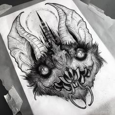 an ink drawing of a demon head