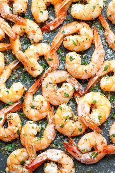 cooked shrimp with herbs and seasoning in a skillet, ready to be eaten