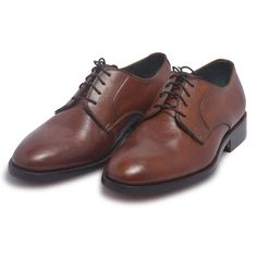 Upgrade your shoe collection with these brown derby genuine leather shoes from the LeatherSkinShop. The handmade design is crafted with care down to the details and comes in the neutral shade of brown to go with most of your dresses. Some of the noteworthy features of these brown derby genuine leather shoes include: The handmade design is crafted to maximize your foot comfort The pair of shoes bears laces with fine details to give you an elegant design The shoes are made with high-quality genuine leather These shoes come in the color brown to complement most of the pieces in your wardrobe Set your style a class apart with this elegant design that is a work of brilliance and finesse. Brown Leather Lace-up Shoes For Semi-formal Occasions, Brown Goodyear Welted Lace-up Derby Shoes, Brown Goodyear Welted Almond Toe Oxfords, Elegant Brown Derby Shoes With Rubber Sole, Cognac Leather Cap Toe Shoes For Derby, Elegant Brown Almond Toe Derby, Elegant Brown Derby With Almond Toe, Elegant Brown Almond Toe Derby Shoes, Elegant Brown Derby Shoes With Almond Toe