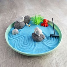 there are rocks in the water with animals on it