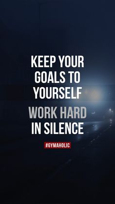 a dark road with the words keep your goals to yourself work hard in silentce