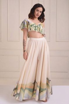 Ivory organic cotton lehenga with placement print. Comes with one-shoulder crop top.
Components: 2
Pattern: Printed
Type Of Work: Placement
Neckline: One-Shoulder
Sleeve Type: Half
Fabric: Organic cotton
Color: Ivory
Other Details: 
Pockets on lehenga
Occasion: Mehendi and Haldi,Sangeet - Aza Fashions White Sets For Summer Reception, White Summer Sets For Reception, Summer White Reception Sets, White Summer Reception Sets, Hand Embroidered Butterfly, Butterfly Crop Top, Purple Lehenga, Lehenga Crop Top, Crop Top Lehenga