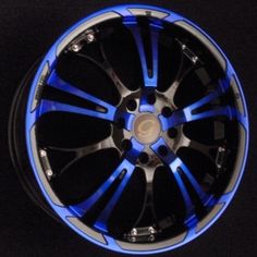 a wheel that is blue and black with some lights on the rim, it appears to be painted