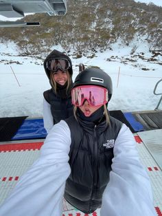 two people in ski gear taking a selfie