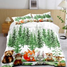 an image of a bed with animals in the woods on it and pine trees behind