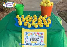 a table topped with lots of yellow rubber ducks