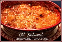 an old fashioned breaded tomato casserole in a red bowl on a plate