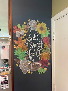 a chalkboard with the words sale sweet fall painted on it in front of a door