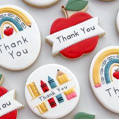 decorated cookies with thank you written on the top and back to school decorations in different colors