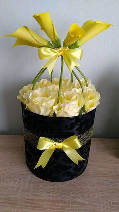 a black hat with yellow flowers in it