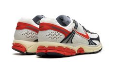 The Nike Zoom Vomero 5 "USA" is a patriotic colorway of the retro running and lifestyle shoe.  The Nike Zoom Vomero 5 debuted in 2010 and was later part of the popular Y2K sneaker trend in the 2020s.  Here, on the “USA” colorway, the shoe sports the colors of the American Flag: red, white, and blue.  Specifically, the upper features a Summit White mesh base and Navy leather overlays.  A Picante Red Swoosh can be found on both sides, while more red accenting appears on the heel overlay and on the heel of the rubber outsole.  Classic “Nike Zoom Vomero 5” detailing is located on the tongue tag.  A cream midsole gives the shoe an aged look.  Release date: June 29, 2024 Sporty Marathon Sneakers With Vibram Sole, Casual Running Shoes With Vibram Sole For Marathon, Nike Retro Running Sneakers, Nike Retro Custom Sneakers For Sports, Retro Nike Running Sneakers, Retro Nike Sneakers For Running, Retro Nike Custom Sneakers, Retro High-top Running Shoes, Sporty Running Shoes With Vibram Sole For Marathon