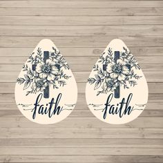 two stickers with the words faith and flowers on them, against a wooden background