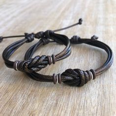 "These lovely bracelets are made with waxed cord, brown rubber spacers, and sterling silver links. Designed for couples If you choose \"Custom Initials Set\" Please leave me a note at checkout with the initials. Both bracelets are adjustable. One closes to 6\" and opens to 9\", the other closes around 7\" and opens to 10\". Includes Gift Box if you choose the set option in the dropdown menu." Couples Promise Bracelet Jewelry, Personalized Adjustable Beaded Bracelets For Promise, Brown Resizable Jewelry For Gifts, Adjustable Couples Promise Jewelry, Adjustable Couples Jewelry For Promise, Adjustable Minimalist Charm Bracelet For Anniversary, Adjustable Cord Round Friendship Bracelets, Adjustable Cord Round Friendship Bracelet, Adjustable Brown Jewelry For Friendship