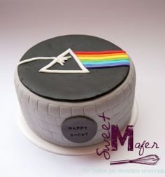 a cake that is decorated to look like a music player with a rainbow on top