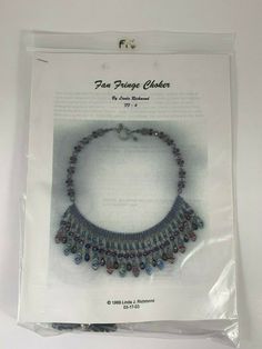 the beaded choker is packaged in a plastic package for $ 3, 99