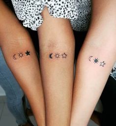 two women with matching tattoos on their legs, both showing the moon and star tattoo designs