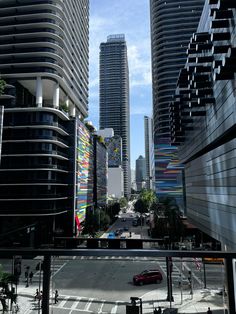 a city street filled with tall buildings next to each other