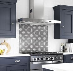 a kitchen with blue cabinets and white counter tops is pictured in this image, there are bananas on the stove