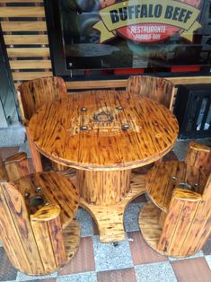 an outdoor table and chairs made out of wood