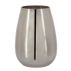 a large silver vase sitting on top of a white table