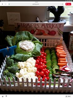 a white basket filled with lots of vegetables