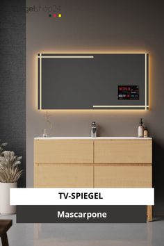 a bathroom vanity with lights above it and a mirror over the sink that says tv spiegl mascarpone