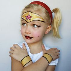 Wonderwoman done by fanciful facepainting  look it up on facebook Super Hero Face Paint Easy, Wonder Woman Face Paint, Superhero Face Painting Easy, Wonder Woman Makeup Tutorial, Superman Face Painting, Face Painting Wonder Woman, Simple Superhero Face Paint, Carnaval Make-up