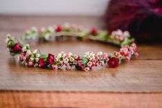 a close up of a flower crown on a table