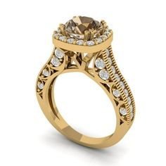 a yellow gold engagement ring with an oval shaped center stone surrounded by smaller round diamonds