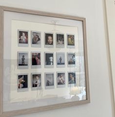 a white framed photo hanging on the wall