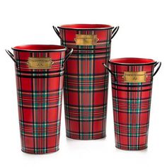 three red and green plaid buckets sitting next to each other