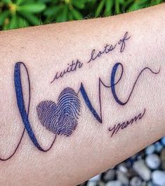 a person with a fingerprint on their arm that says,'love you're