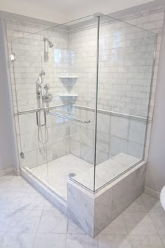 a walk in shower sitting inside of a bathroom