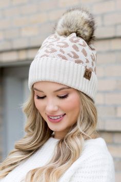 Stay warm and stylish with this C.C leopard print beanie, featuring a playful faux fur pom. The soft knit fabric ensures comfort, while the trendy leopard spots add a fashionable twist. This winter must-have is ideal for adding a dash of fun to your cold-weather wardrobe. Material: 100% Soft Acrylic, Faux Fur Pom Style: Slouchy Knit Design, Leopard Print Embellishment: Leopard Print Fits Teen-Adult Authentic Stamped C.C Cc Beanies, Style Beanie, Cc Beanie, Leopard Design, Friend Outfits, Print Trends, Pom Beanie, Fur Pom Pom, Bring It